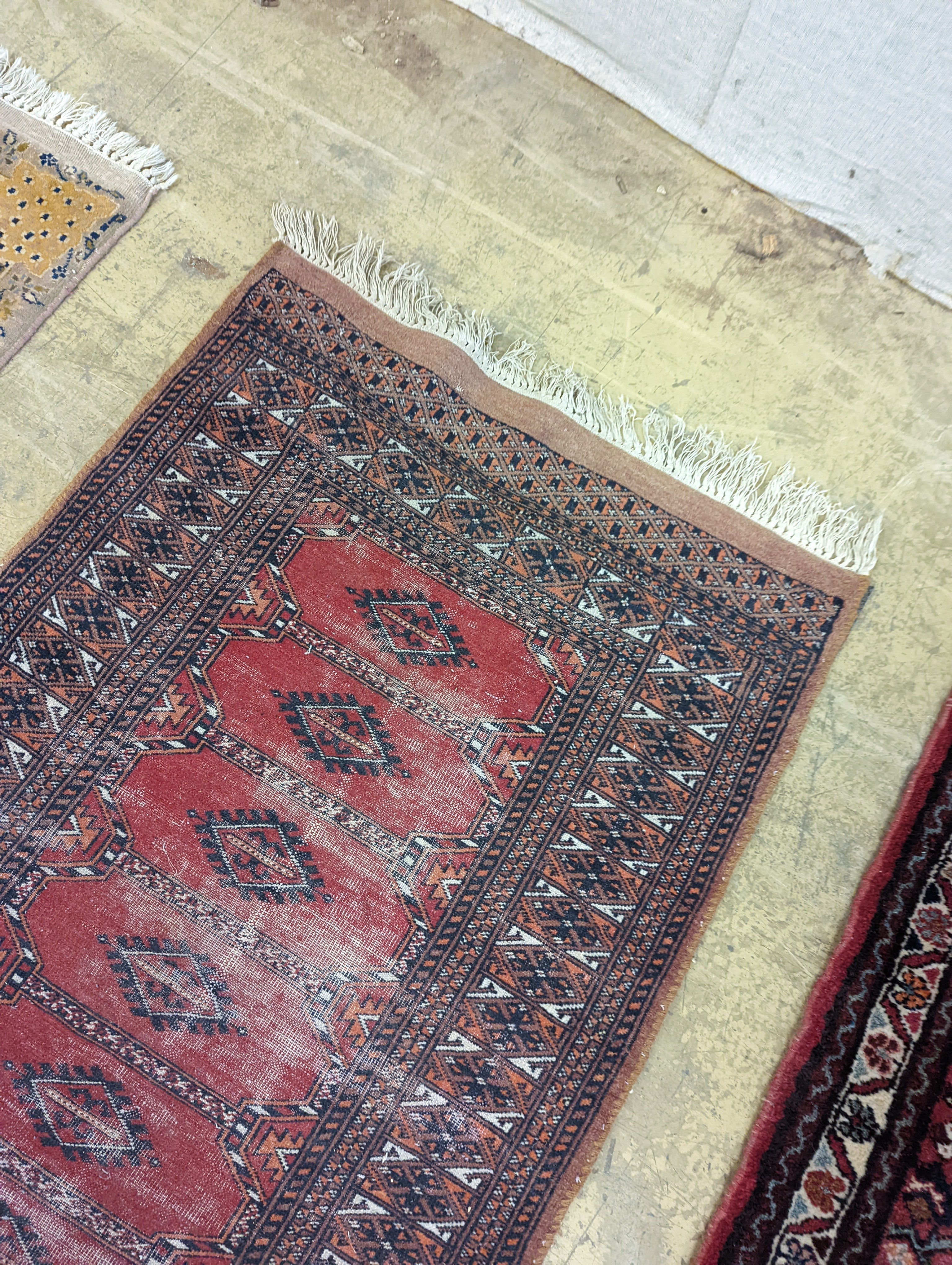 A North West Persian red ground runner and a Bokhara runner, larger approx. 290 x 78cm